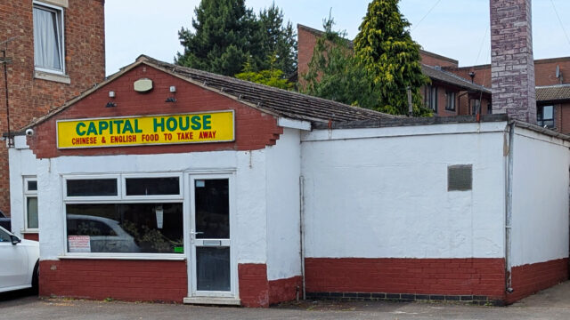 Exterior view of Fleckney Capital House, a Chinese and English takeaway restaurant, showing its white and red facade with a yellow signboard in a residential area.